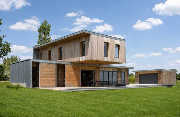 Réalisation d'une maison individuelle contemporaine avec bois et béton dans un esprit Loft par un architecte à Nantes.